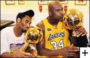 Kobe Bryant and Shaquille O'Neal enjoying the glory of their first championship together.
